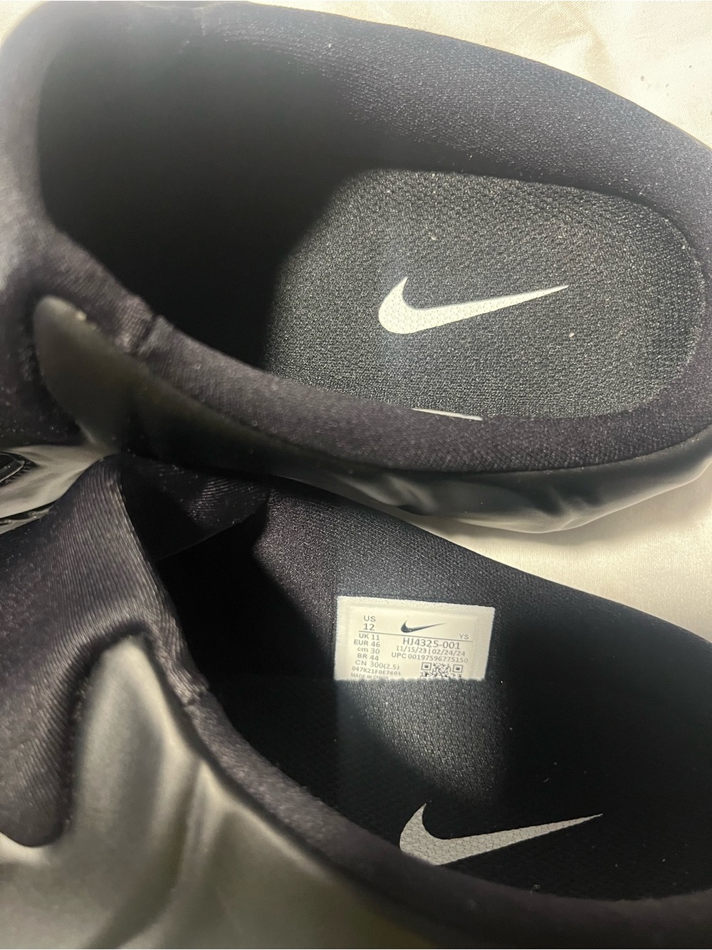Nike Black Slip-On Shoes with White Swoosh Accents